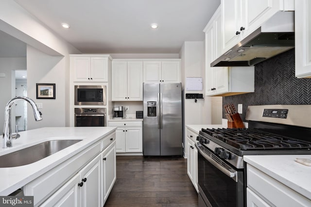 kitchen featuring sink, stainless steel appliances, and white cabinets