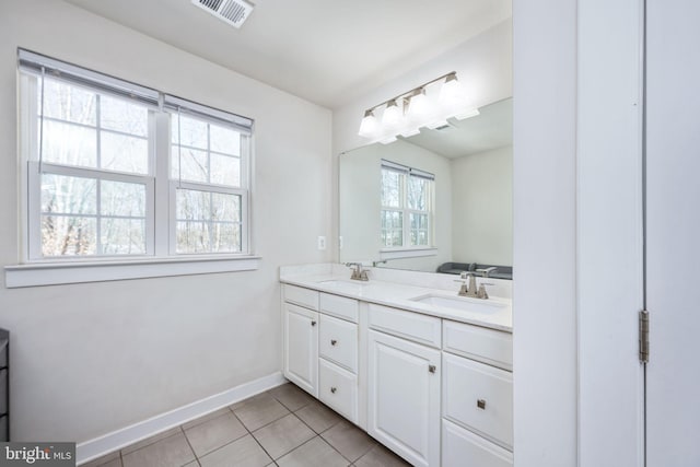 bathroom with tile patterned flooring and vanity