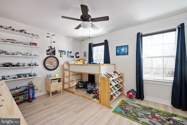 bedroom with ceiling fan and light hardwood / wood-style flooring