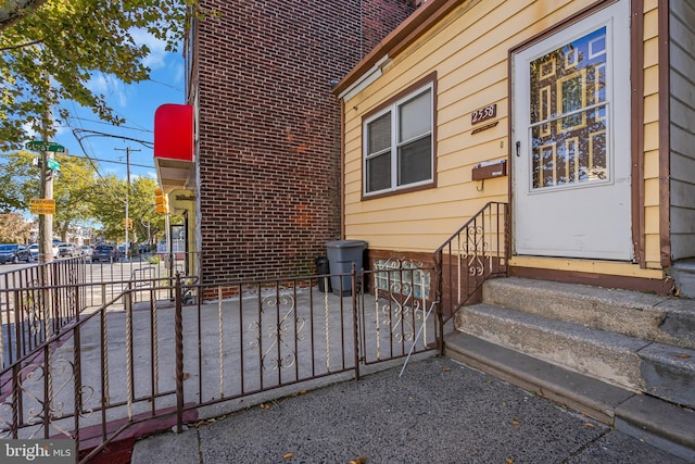 view of exterior entry with fence