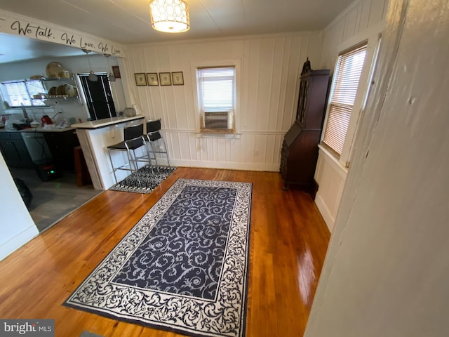 kitchen with crown molding and dark hardwood / wood-style floors