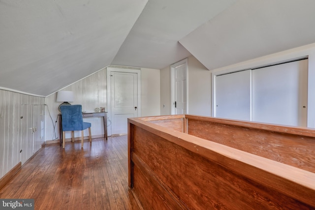 interior space with lofted ceiling and wood finished floors