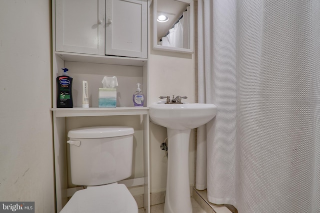 bathroom with sink and toilet