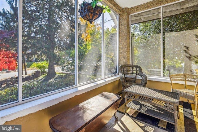 sunroom / solarium featuring a healthy amount of sunlight