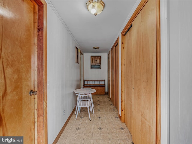 hall featuring light tile patterned flooring