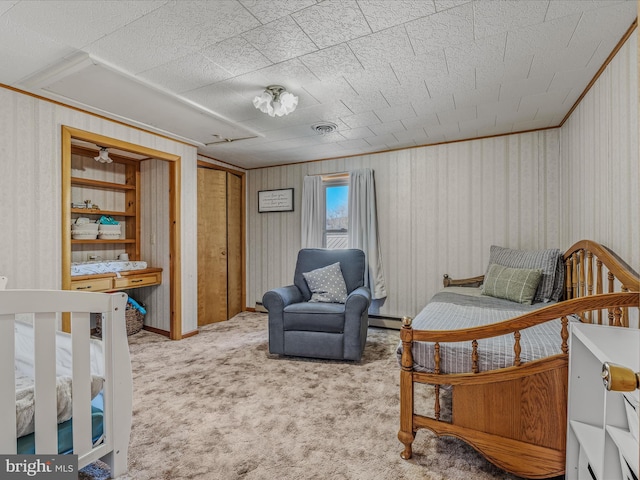 bedroom featuring baseboard heating, light colored carpet, and crown molding