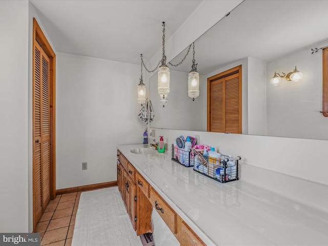 bathroom with tile patterned floors and vanity