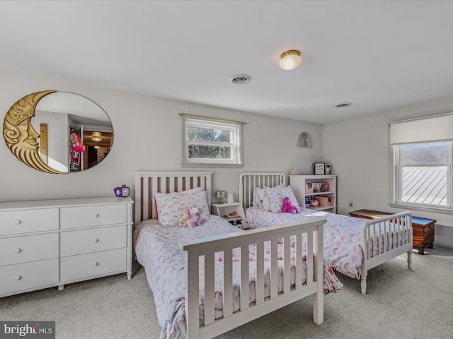 bedroom featuring light colored carpet