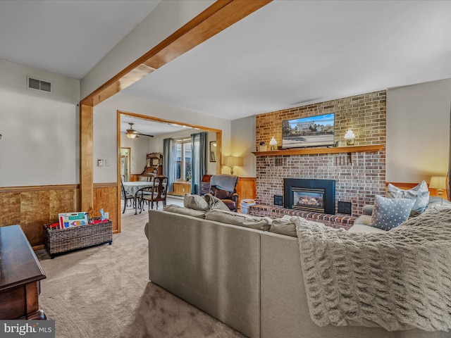 carpeted living room with a fireplace