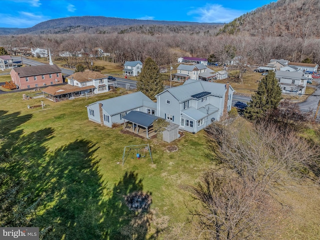 birds eye view of property featuring a mountain view