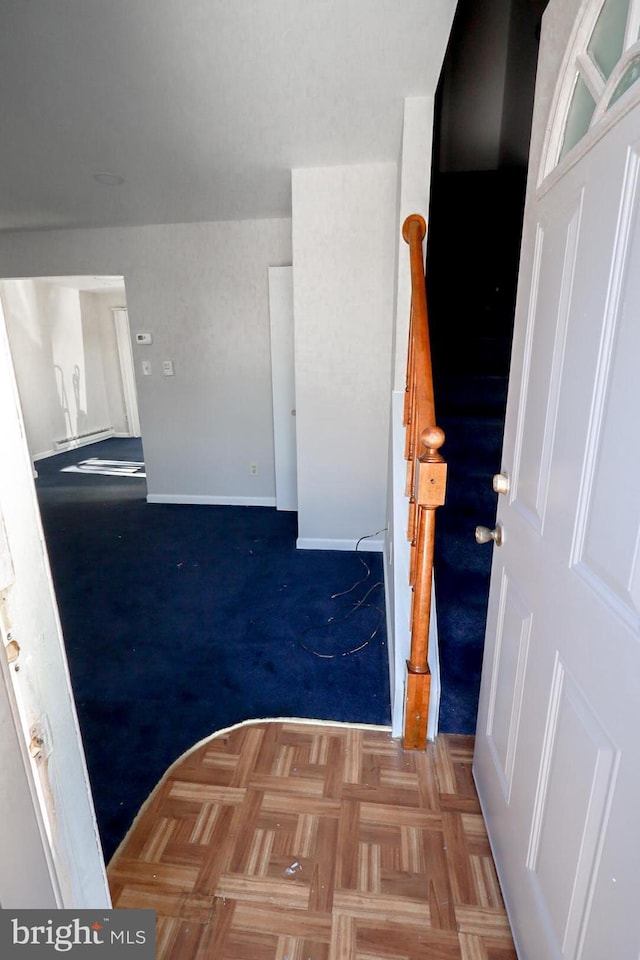 foyer featuring light parquet floors and baseboard heating