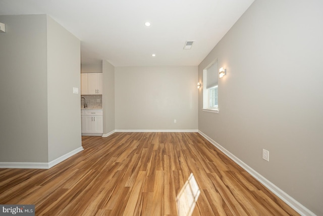 unfurnished living room with light wood-type flooring