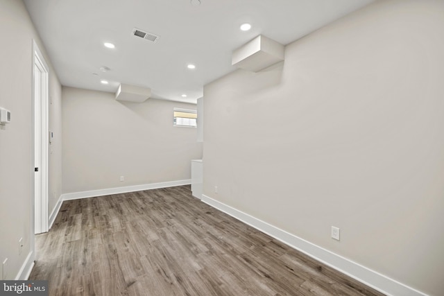 basement featuring wood-type flooring