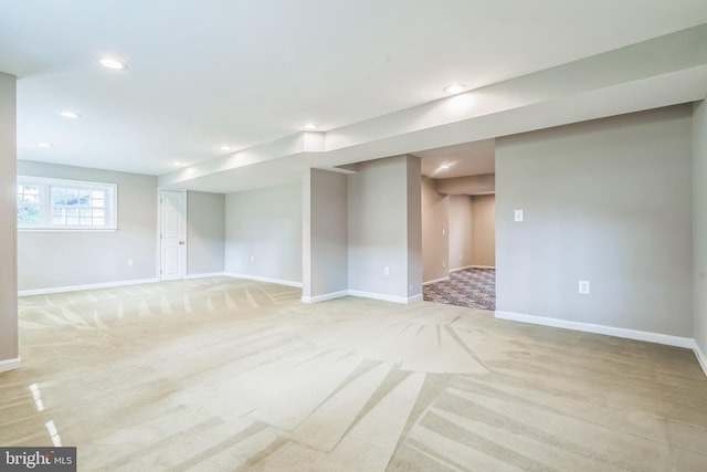 empty room featuring light colored carpet