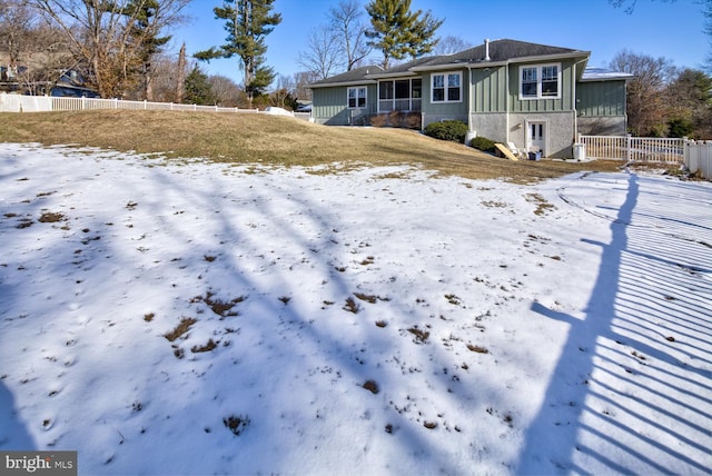 view of snow covered house