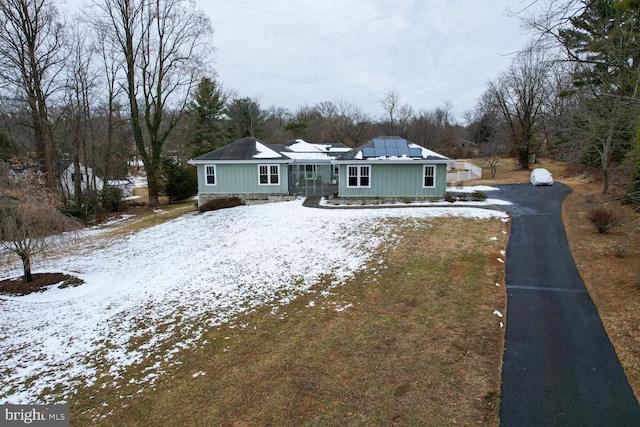 view of front of home featuring solar panels