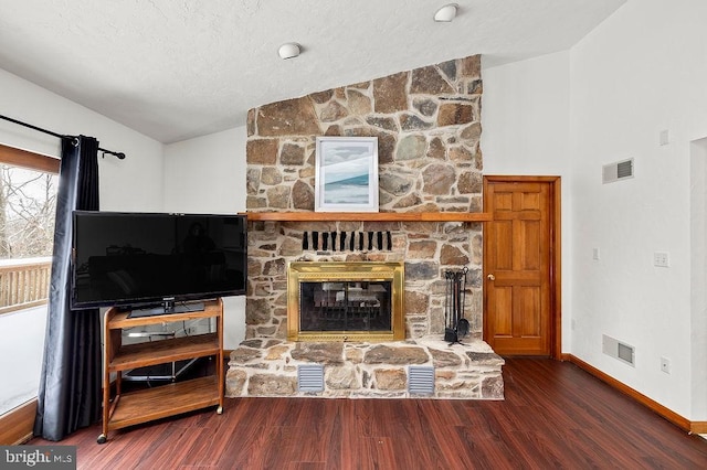 living room with a fireplace, dark hardwood / wood-style flooring, and vaulted ceiling