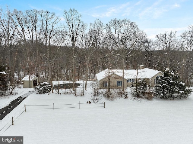 view of yard layered in snow