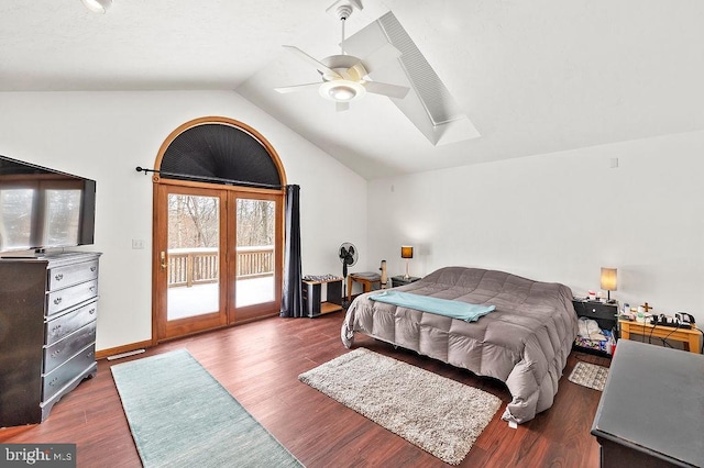 bedroom featuring dark hardwood / wood-style flooring, lofted ceiling, access to exterior, and ceiling fan