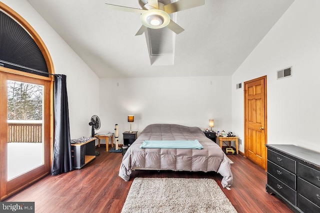 bedroom with dark hardwood / wood-style flooring, vaulted ceiling, and ceiling fan