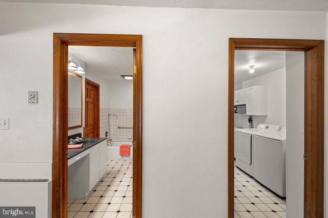 interior space with washer and dryer and sink