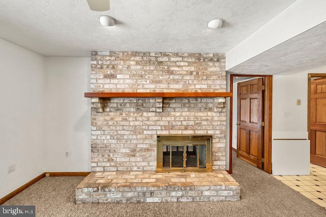 unfurnished living room with a fireplace, a textured ceiling, and carpet flooring