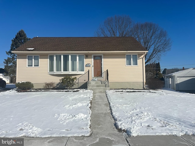 view of front facade with a garage and an outdoor structure