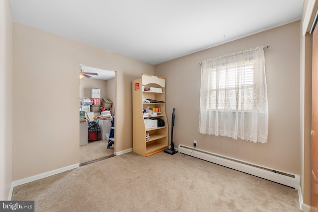 carpeted bedroom with a baseboard radiator