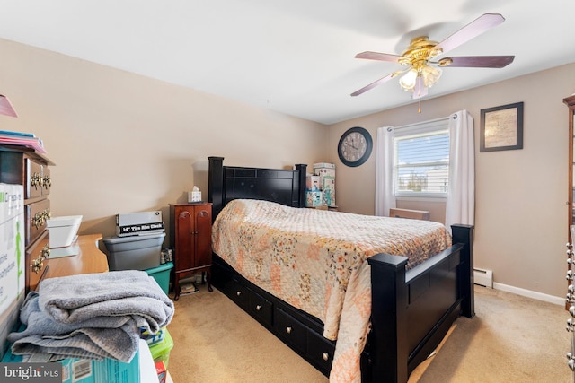 bedroom with ceiling fan, light colored carpet, and baseboard heating