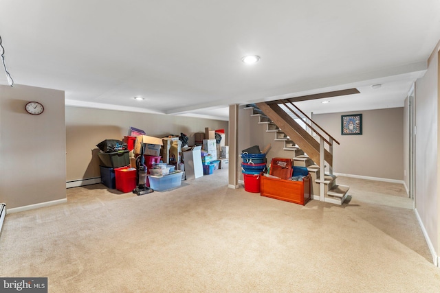 basement featuring light carpet and baseboard heating