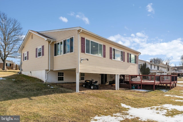 view of side of home with a lawn and a deck