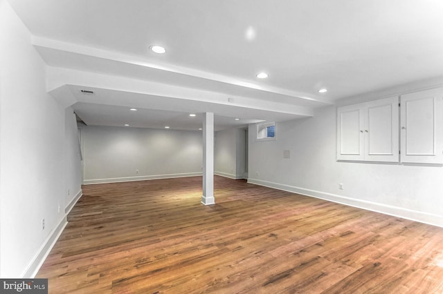 basement featuring hardwood / wood-style flooring