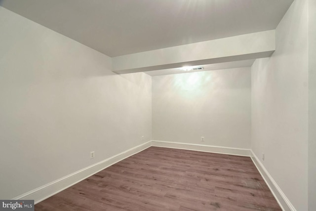 unfurnished room featuring hardwood / wood-style flooring