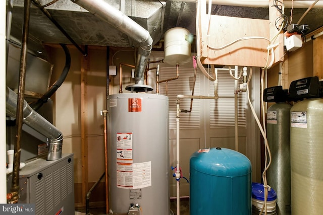 utility room featuring water heater