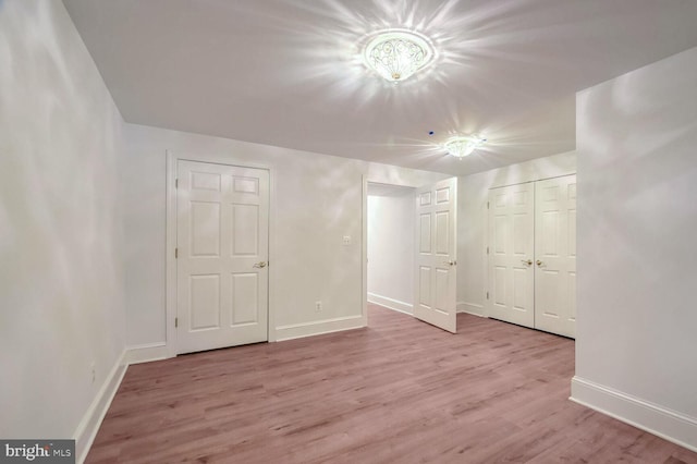 spare room featuring light hardwood / wood-style floors