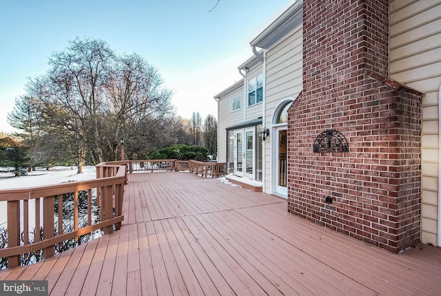 view of snow covered deck