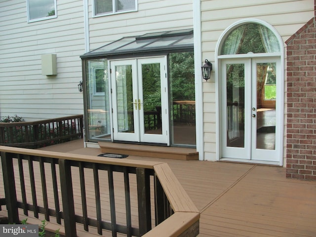 entrance to property with french doors and a deck