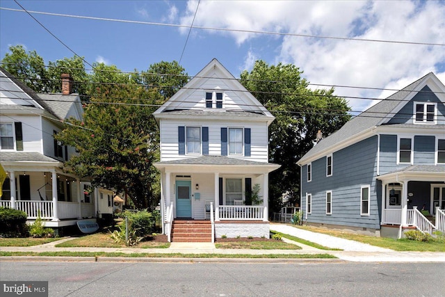 victorian house featuring covered porch