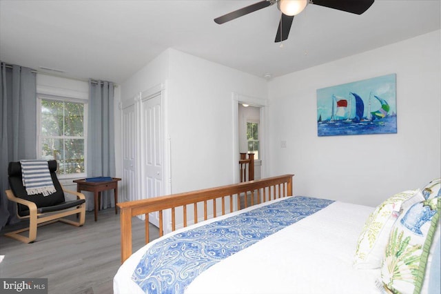 bedroom with hardwood / wood-style floors and ceiling fan