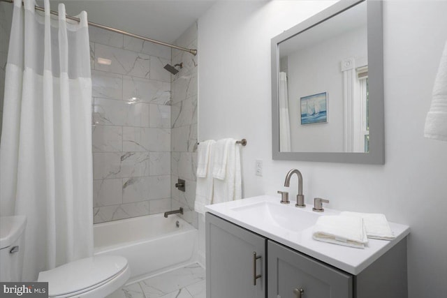 full bathroom with vanity, shower / tub combo, and toilet