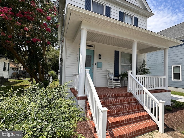 property entrance featuring covered porch