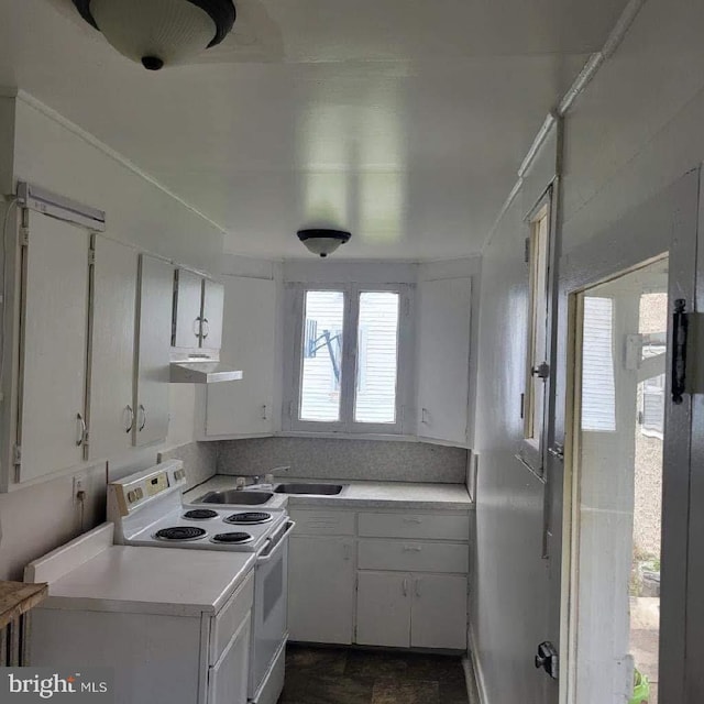 kitchen featuring white cabinetry, sink, and white electric range