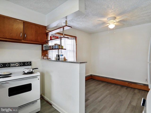 kitchen featuring white range with electric stovetop, wood-type flooring, a baseboard radiator, ceiling fan, and a textured ceiling