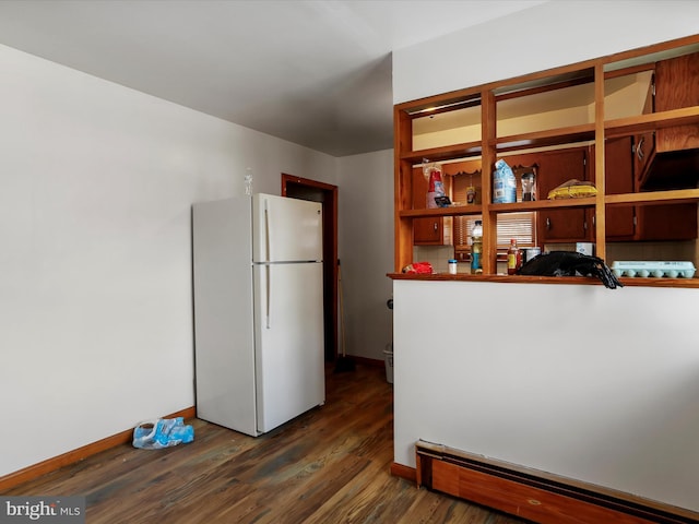 kitchen featuring a baseboard radiator, dark hardwood / wood-style floors, and white refrigerator