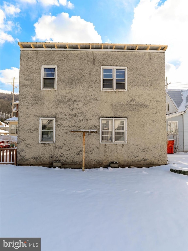 view of snow covered property