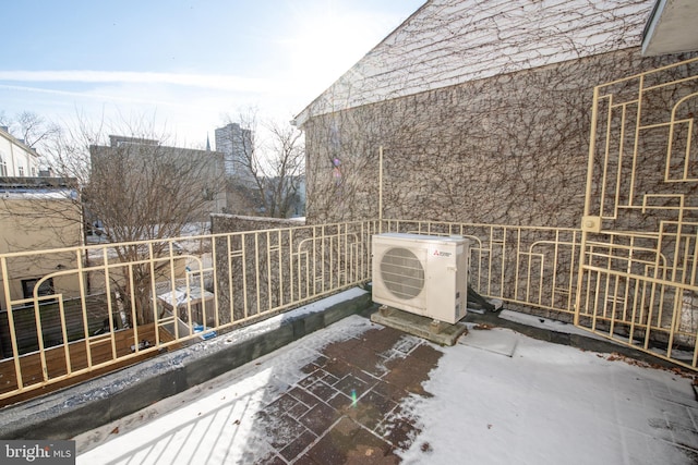 balcony featuring ac unit