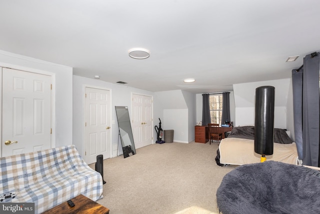 bedroom with light carpet