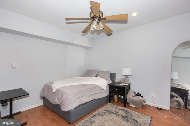 bedroom featuring hardwood / wood-style flooring and ceiling fan