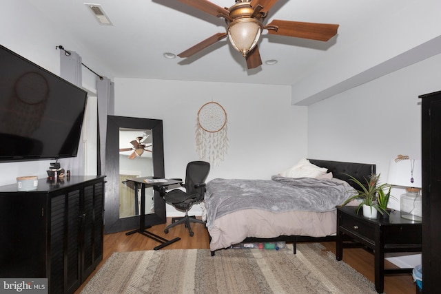 bedroom featuring light hardwood / wood-style flooring and ceiling fan