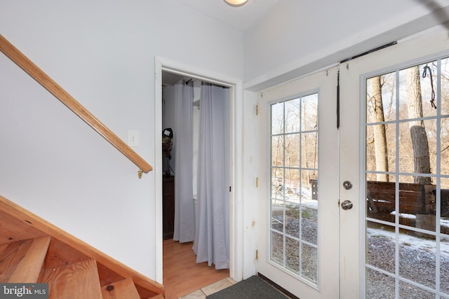 entryway with light tile patterned floors